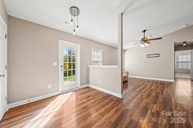 a view of a livingroom with wooden floor