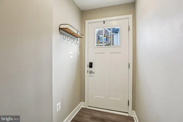 a view of a hallway with front door