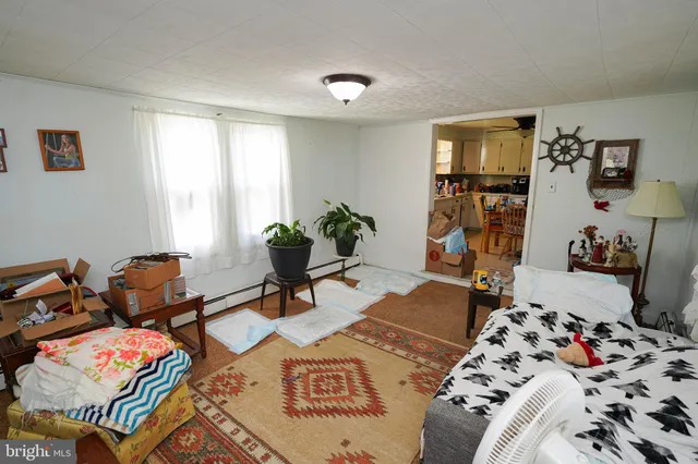a bedroom with furniture and a wooden floor