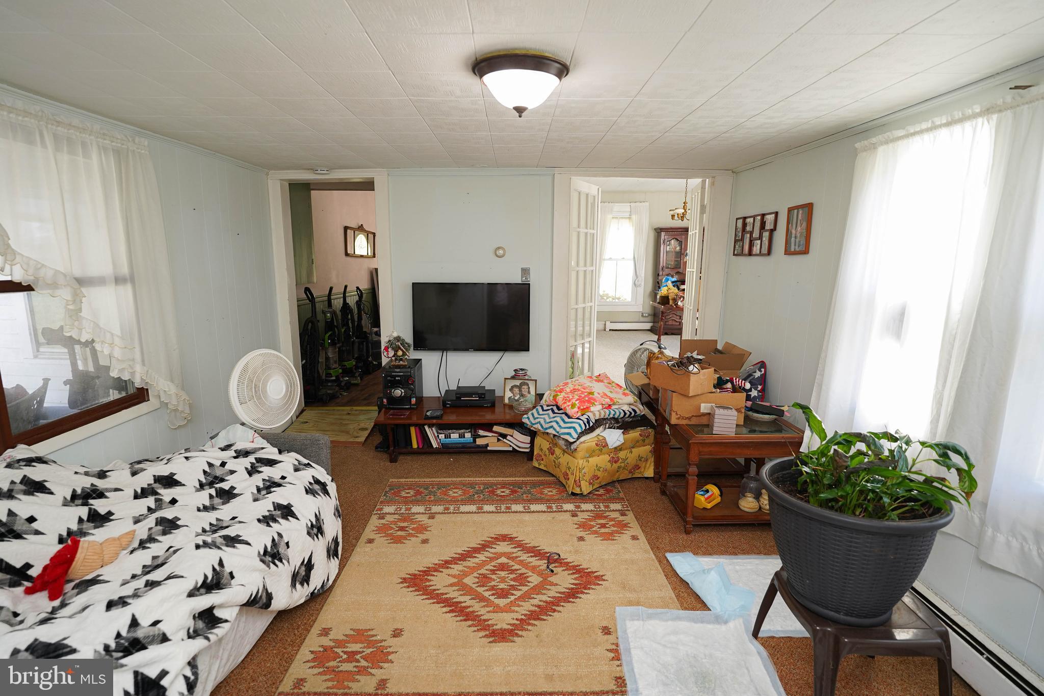 23392 Custom House Road Deal Island, MD 21821 - Photo 14 of 44 a living room with furniture a rug and a window