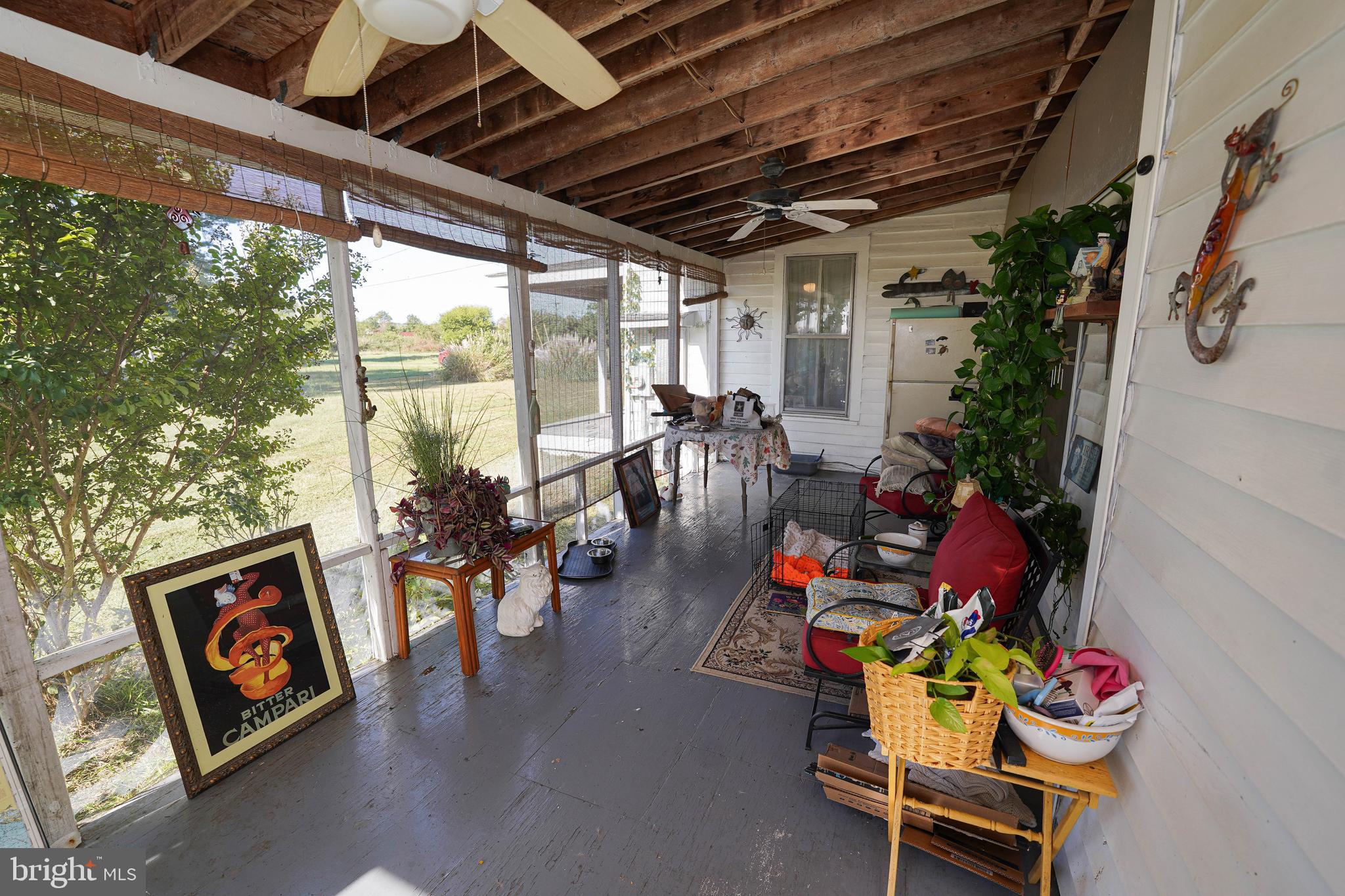 23392 Custom House Road Deal Island, MD 21821 - Photo 20 of 44 a living room with furniture and a large window