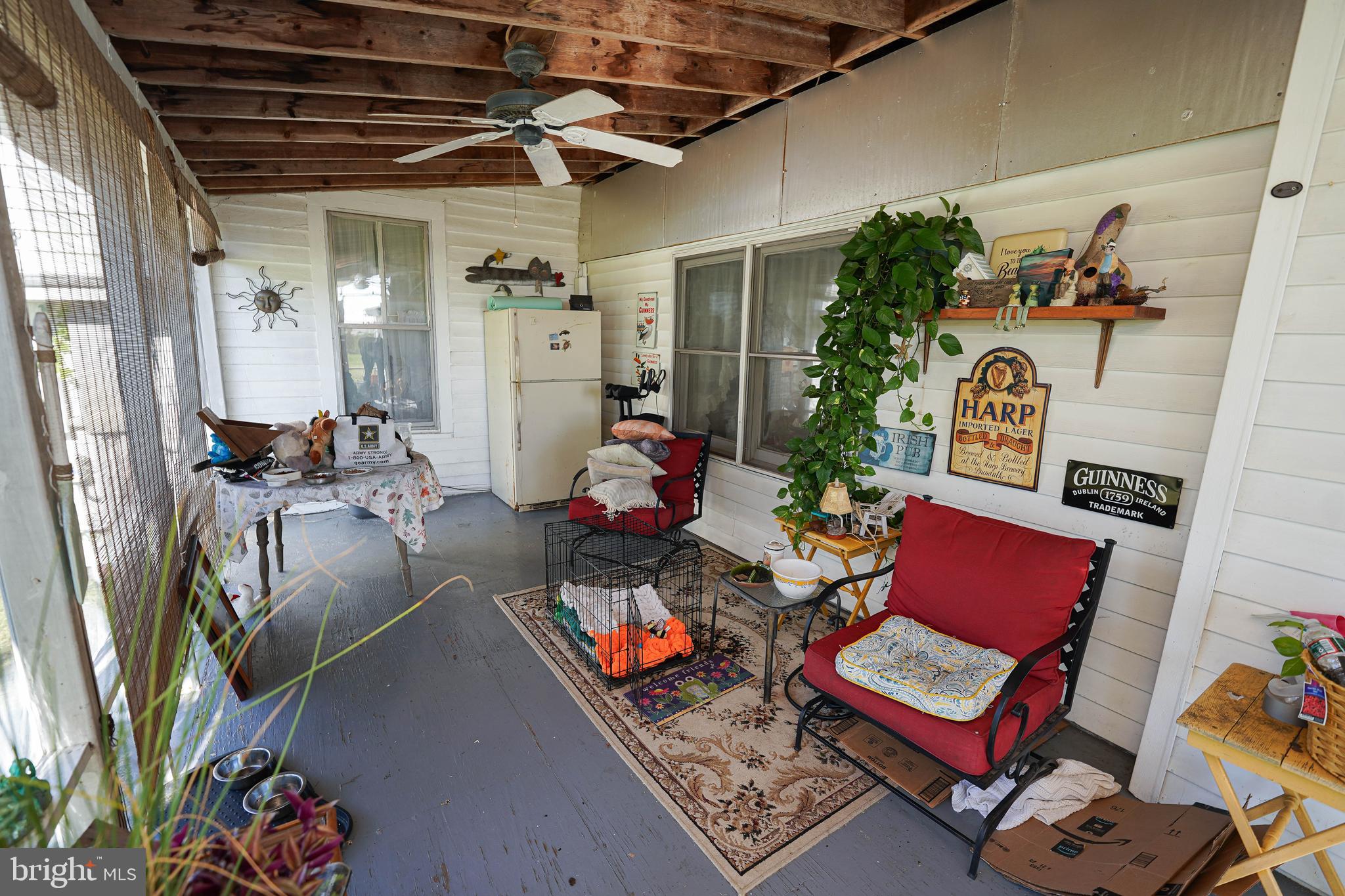 23392 Custom House Road Deal Island, MD 21821 - Photo 21 of 44 a outdoor living space with furniture and a potted plant