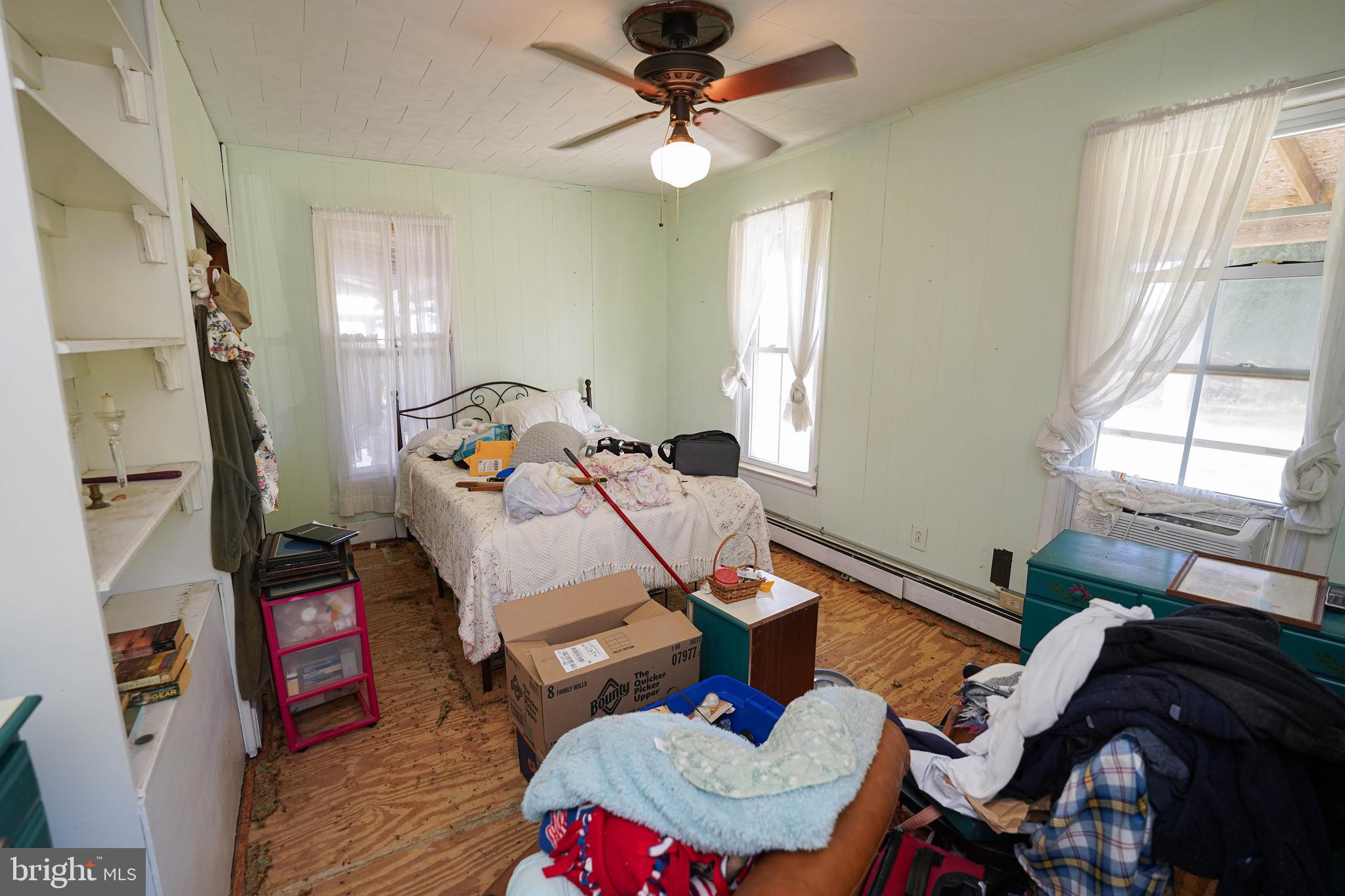 23392 Custom House Road Deal Island, MD 21821 - Photo 23 of 44 a living room with furniture and a window