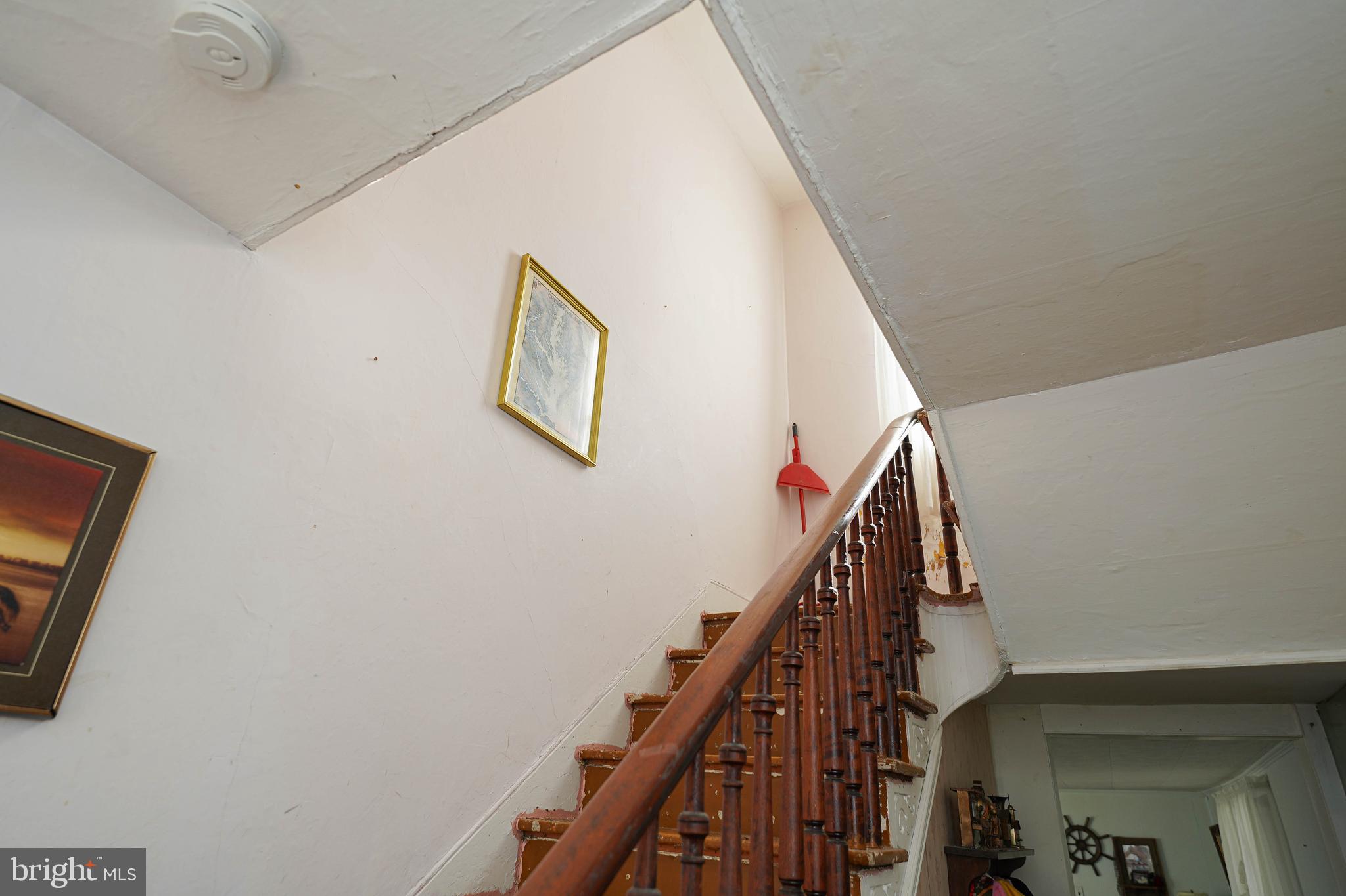 23392 Custom House Road Deal Island, MD 21821 - Photo 26 of 44 a view of staircase with wooden floor and white walls