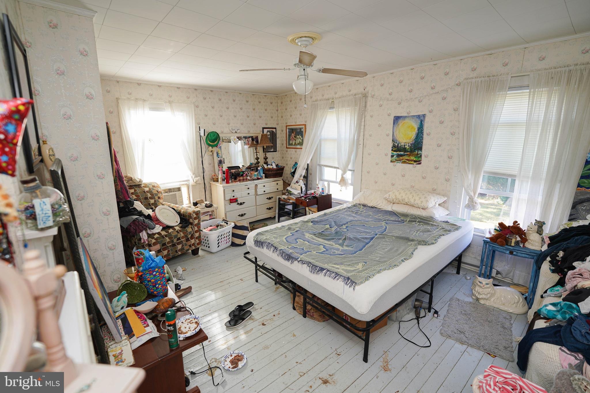 23392 Custom House Road Deal Island, MD 21821 - Photo 28 of 44 a living room with lots of furniture and a table