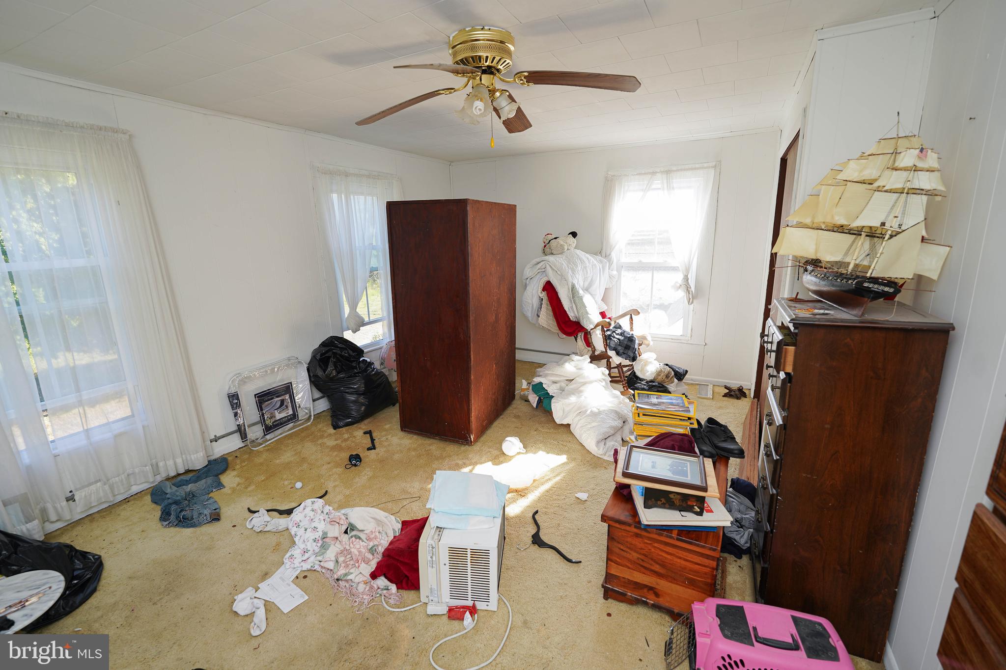 23392 Custom House Road Deal Island, MD 21821 - Photo 30 of 44 a bedroom with furniture and a window