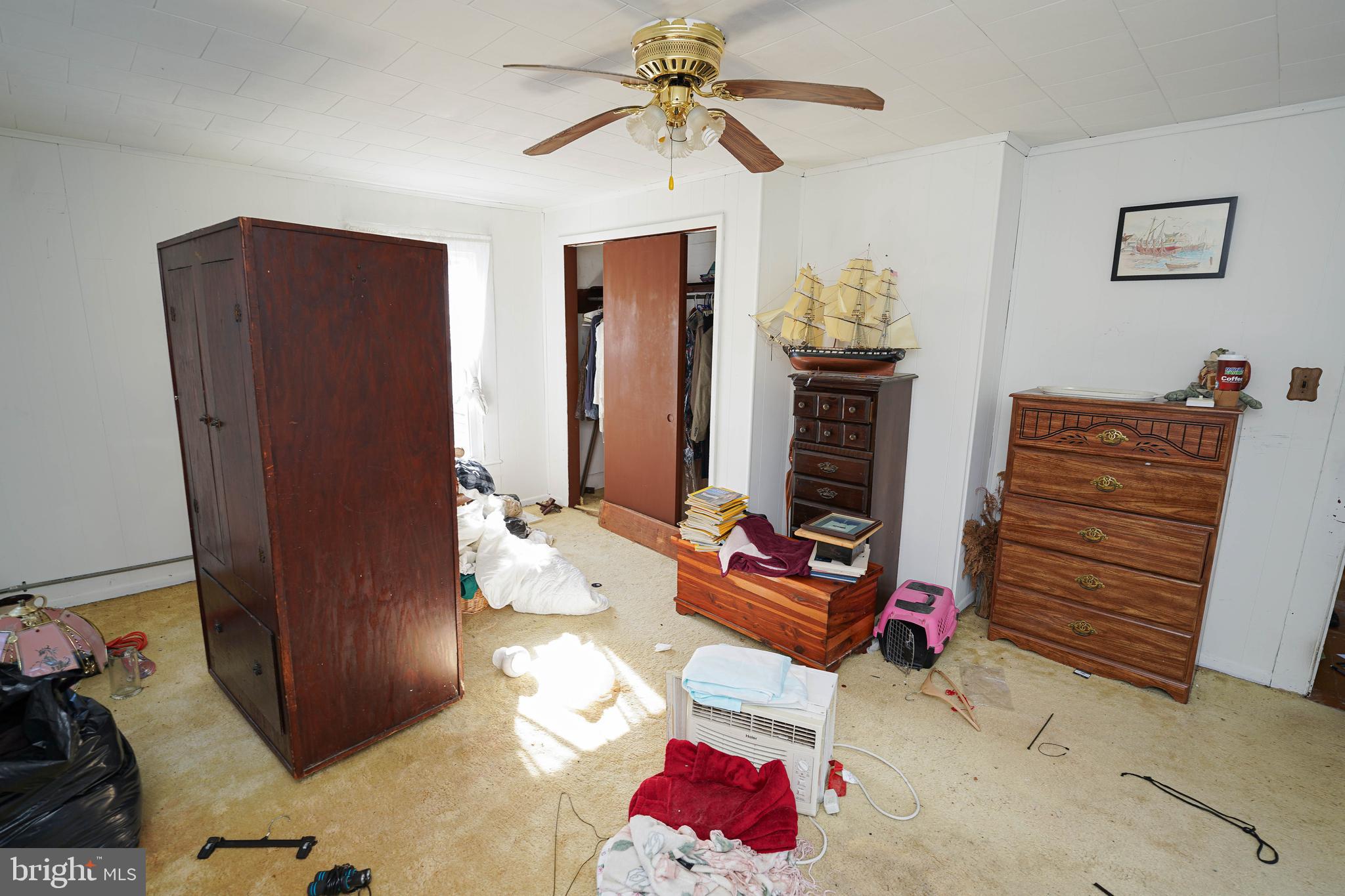 23392 Custom House Road Deal Island, MD 21821 - Photo 32 of 44 a bedroom with furniture and window