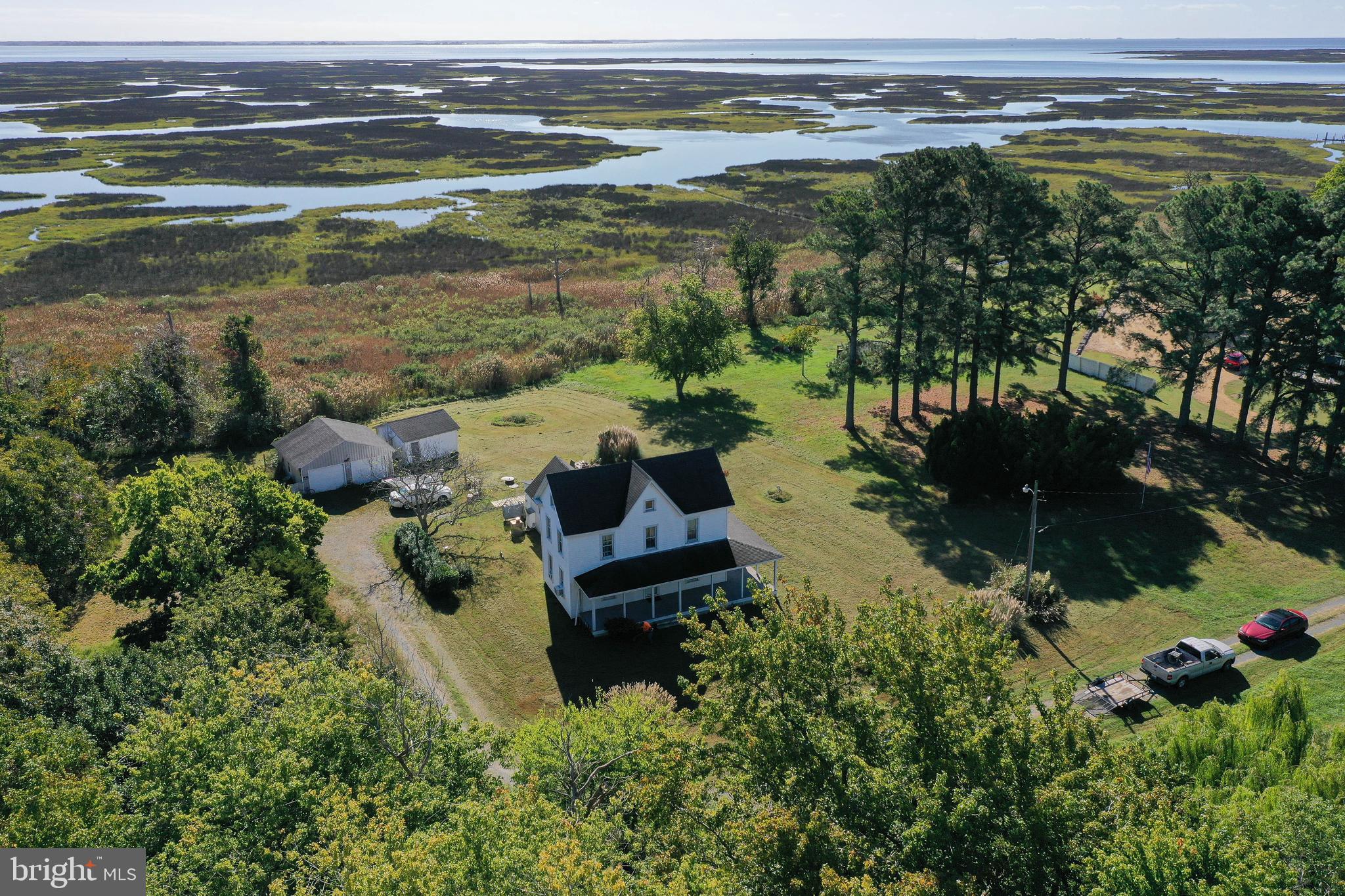 23392 Custom House Road Deal Island, MD 21821 - Photo 36 of 44 a view of a lake with a yard and mountain view