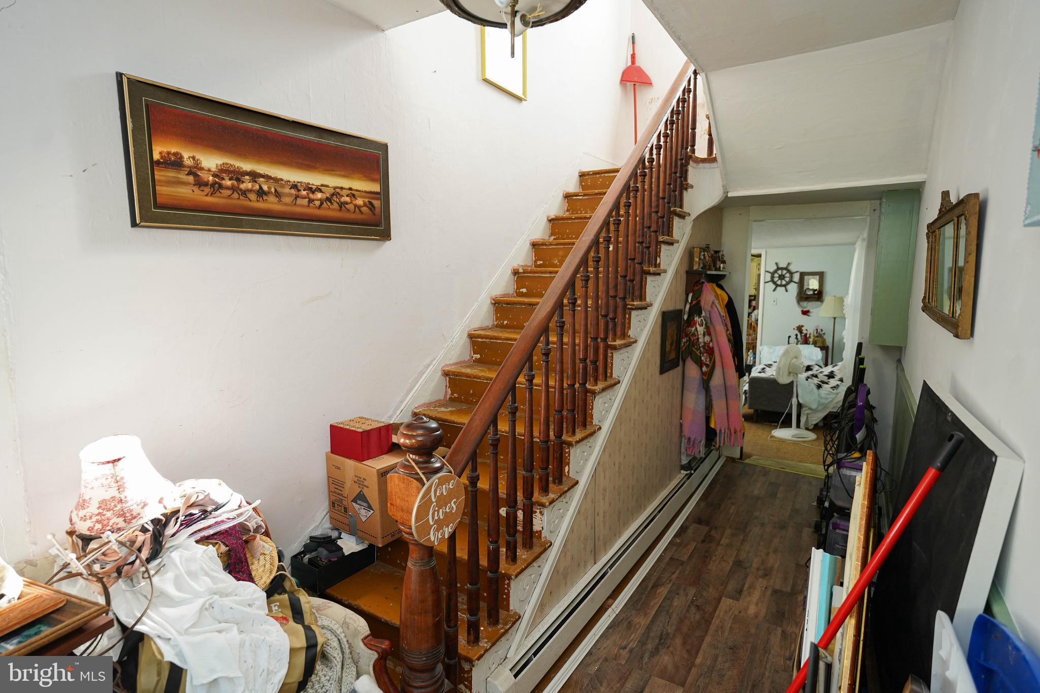 23392 Custom House Road Deal Island, MD 21821 - Photo 8 of 44 a view of a hallway with wooden floor and stairs