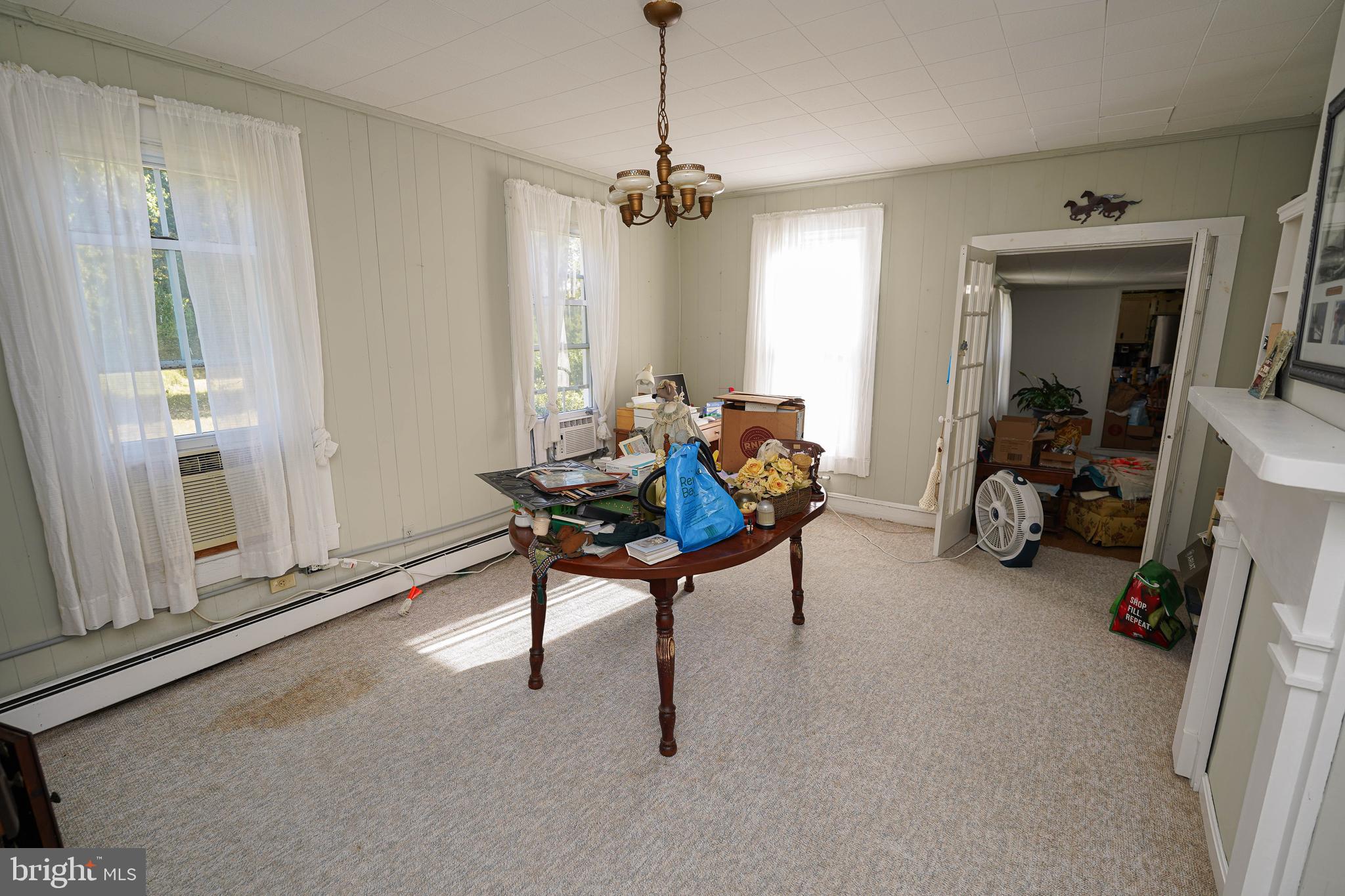 23392 Custom House Road Deal Island, MD 21821 - Photo 9 of 44 a living room with furniture a window and gym equipment