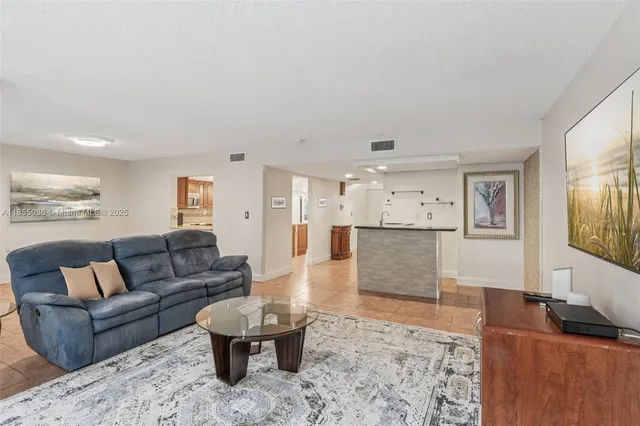 a living room with furniture and a couch