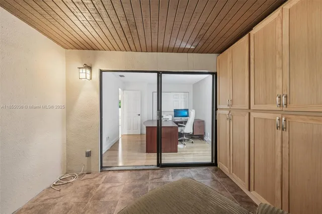 a lobby with furniture and floor to ceiling window