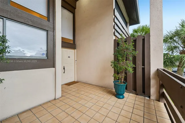 a car parked in front of a brick house