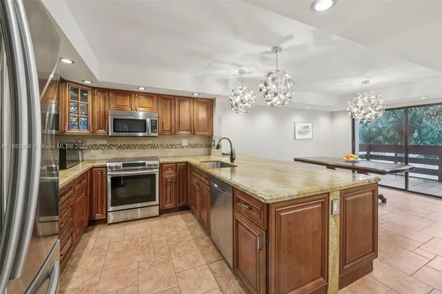 a kitchen with a stove and a sink