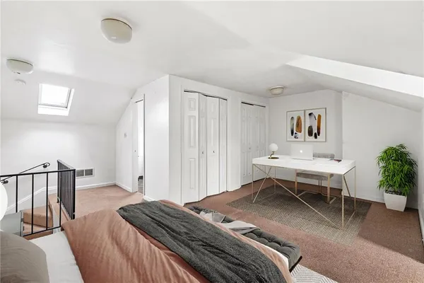 a bedroom with a bed and a dresser