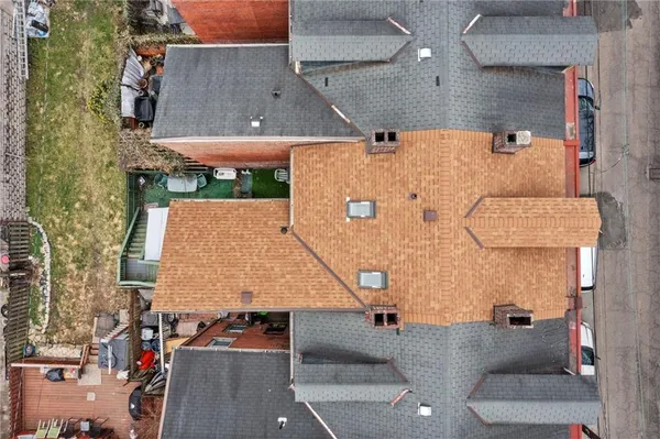 an aerial view of residential houses with outdoor space