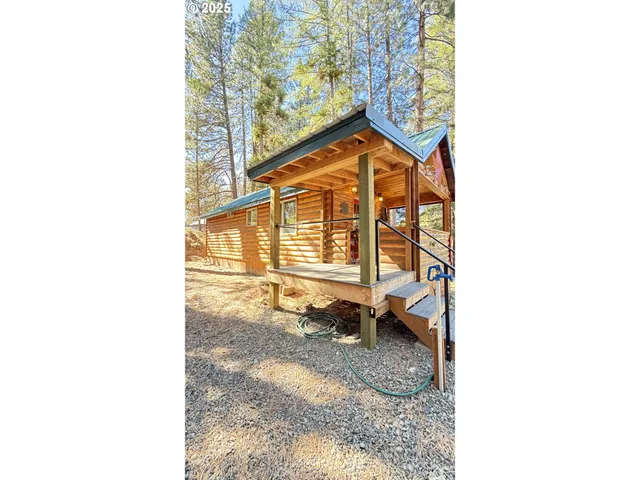 a living room with a couch and wooden floor