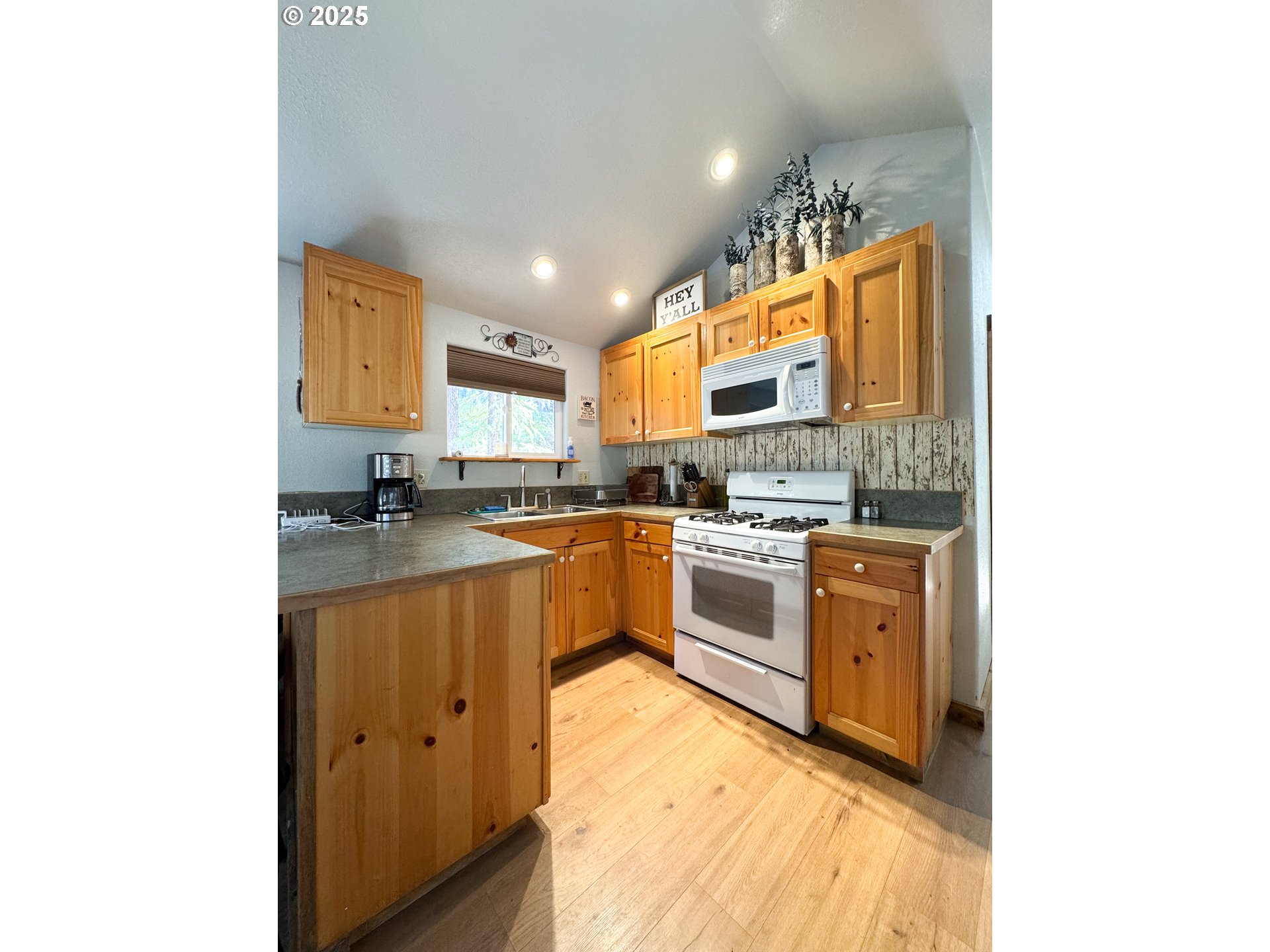 255 East North Street Sumpter, OR 97877 - Photo 2 of 20 a kitchen with stainless steel appliances granite countertop a sink and cabinets