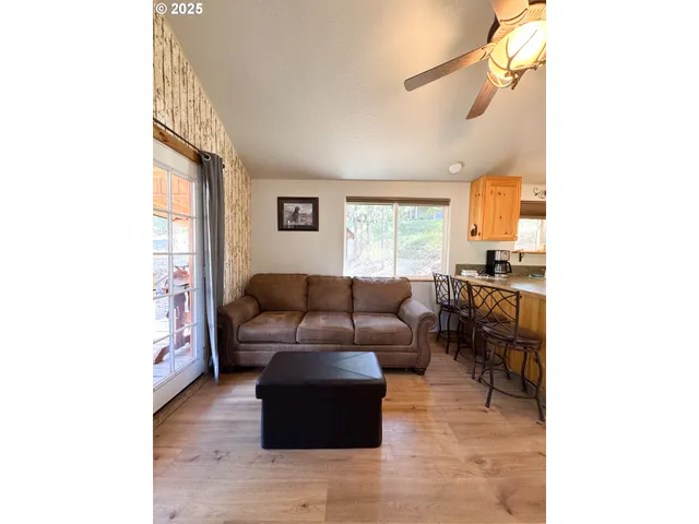 a living room with furniture and a window