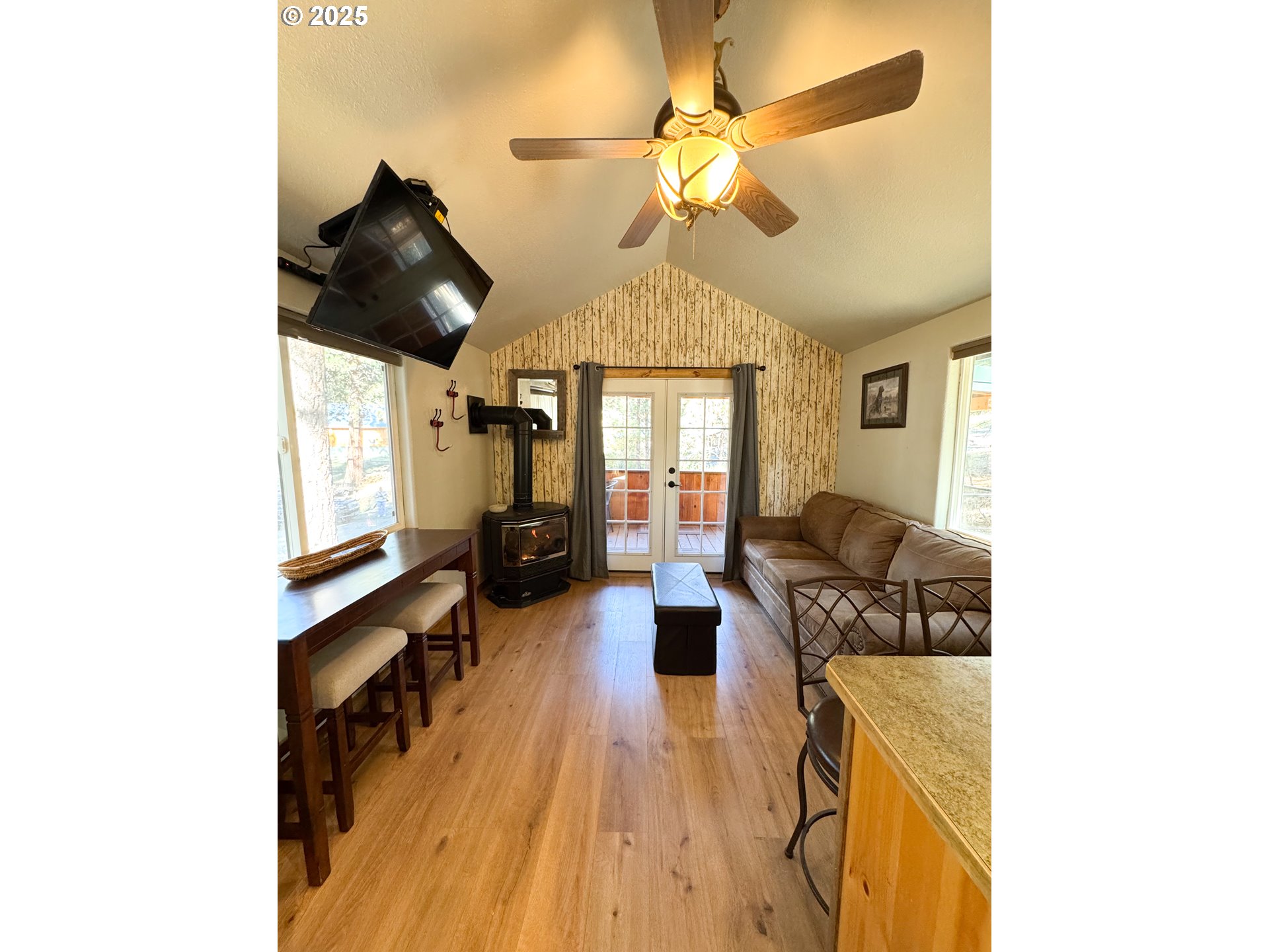 255 East North Street Sumpter, OR 97877 - Photo 7 of 20 a living room with furniture and a chandelier
