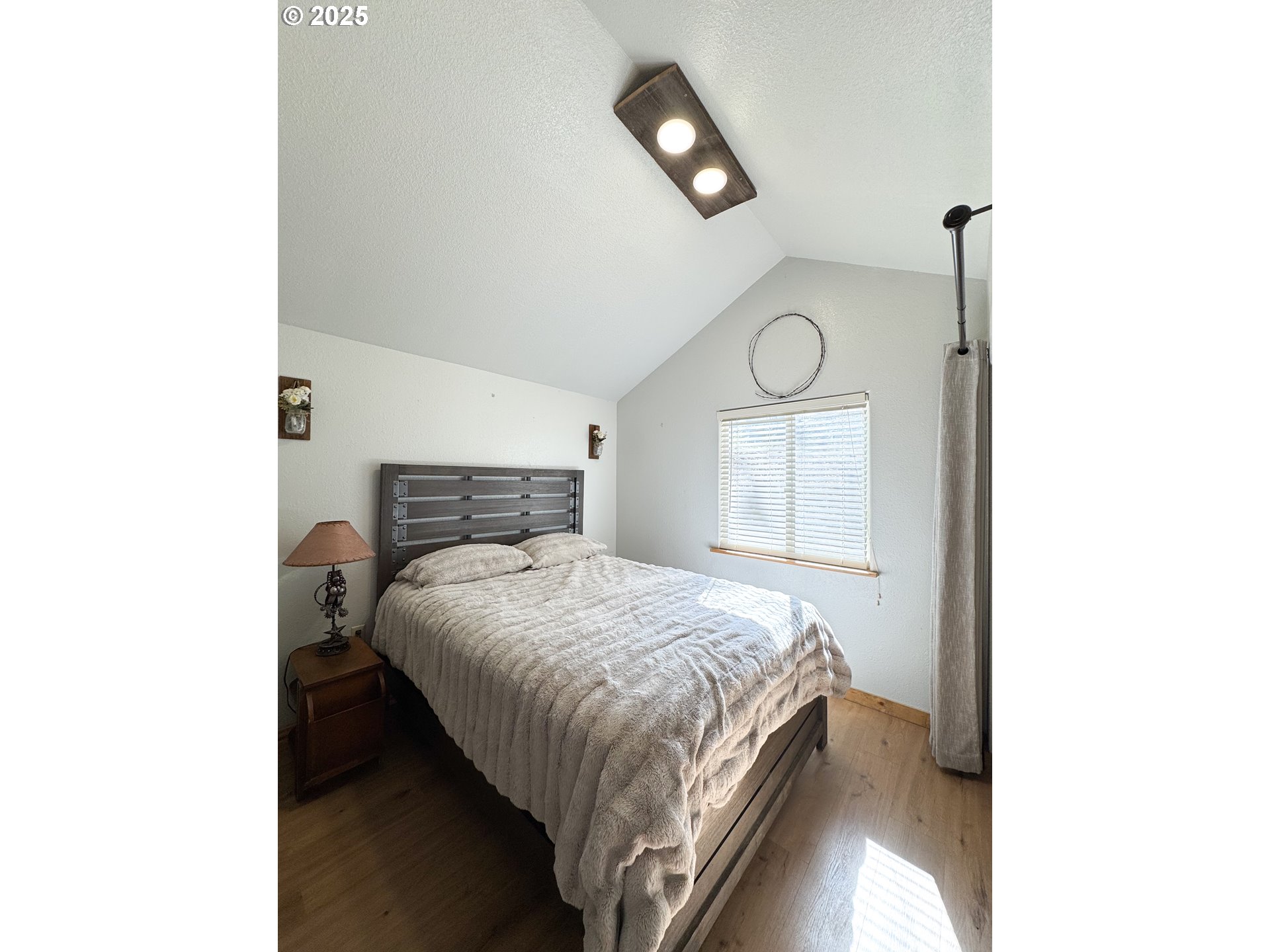 255 East North Street Sumpter, OR 97877 - Photo 9 of 20 a bedroom with a bed and a window