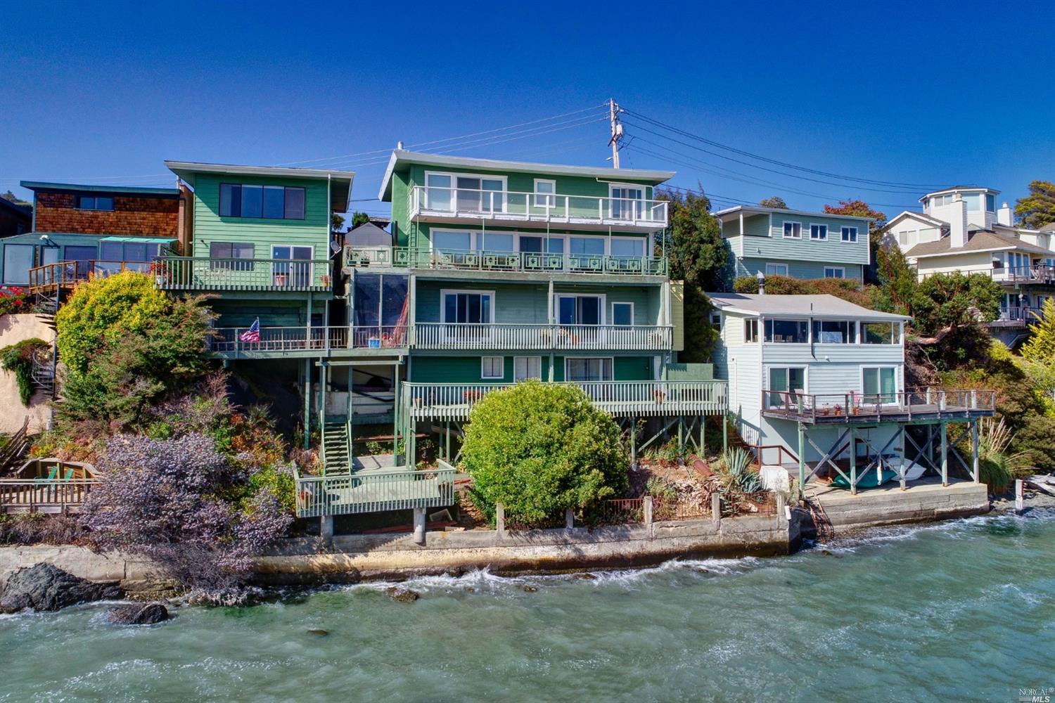 400 Greenwood Beach Road Tiburon, CA 94920 - Photo 1 of 1 a front view of a house with a yard table and chairs