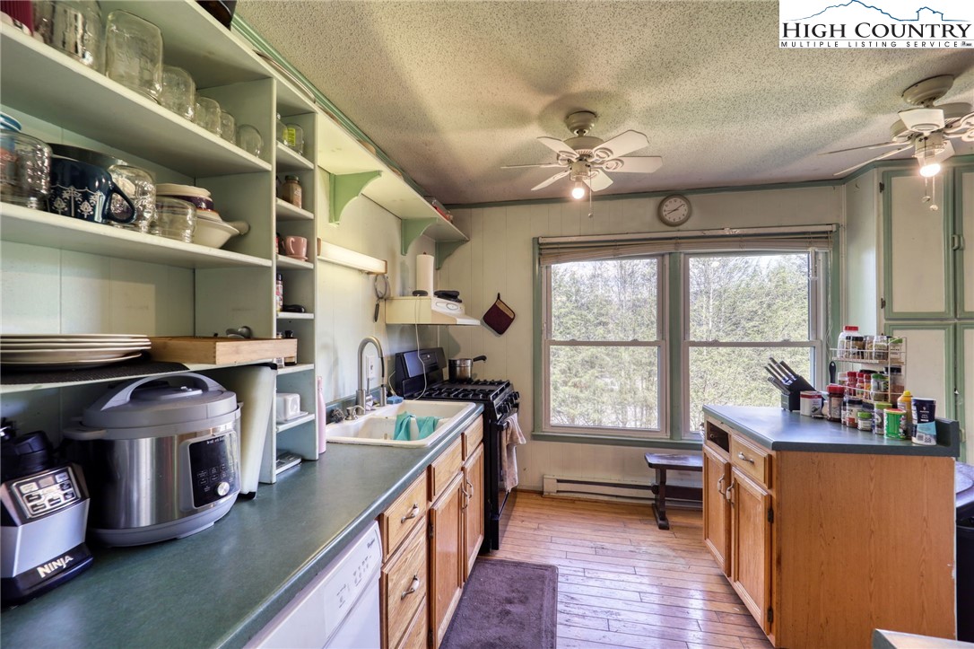 191 Alex Wellborn Road Deep Gap, NC 28618 - Photo 11 of 39 a kitchen with lots of counter top space