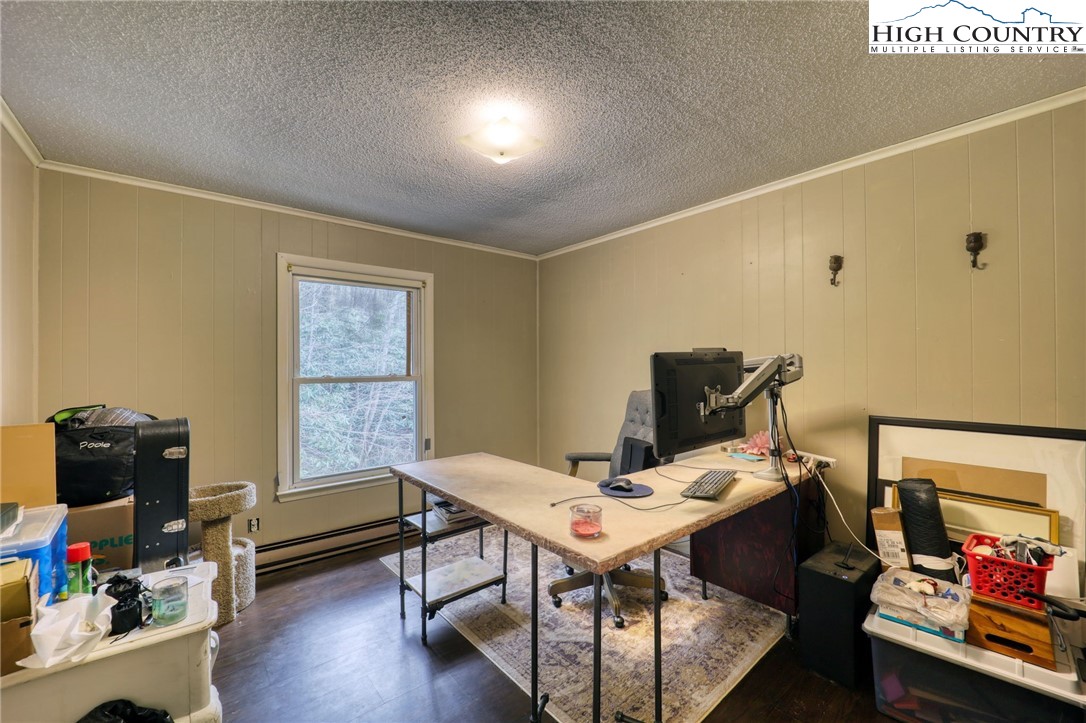 191 Alex Wellborn Road Deep Gap, NC 28618 - Photo 19 of 39 a view of a workspace with furniture and toys