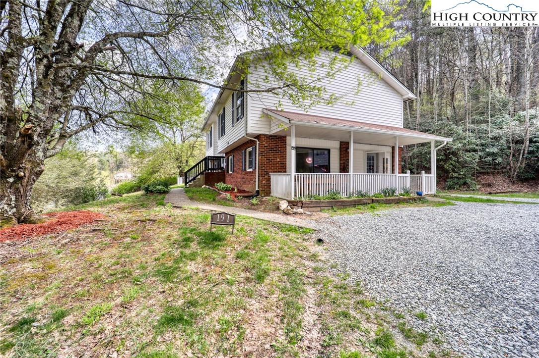 191 Alex Wellborn Road Deep Gap, NC 28618 - Photo 2 of 39 a view of house with a yard