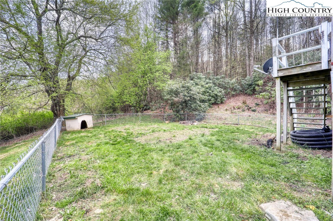 191 Alex Wellborn Road Deep Gap, NC 28618 - Photo 38 of 39 a backyard of a house with seating space