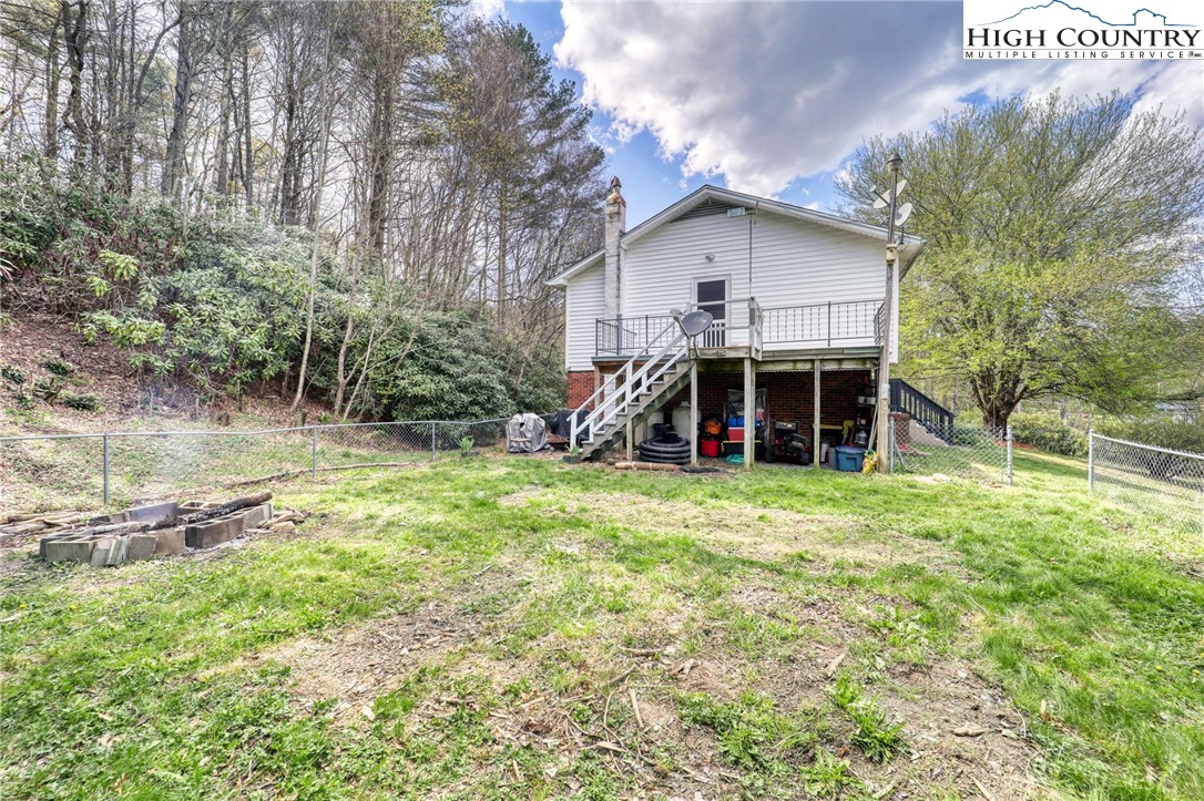 191 Alex Wellborn Road Deep Gap, NC 28618 - Photo 39 of 39 a view of a house with backyard and garden