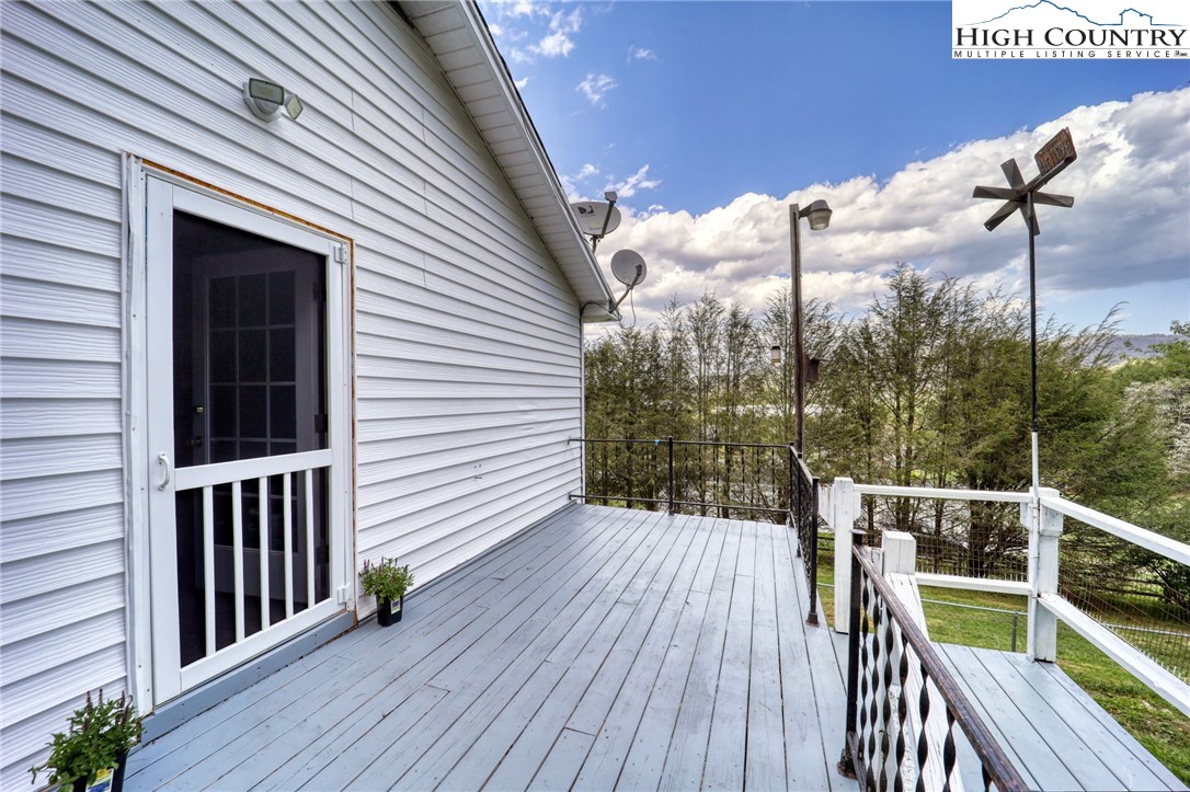 191 Alex Wellborn Road Deep Gap, NC 28618 - Photo 10 of 39 a view of a balcony with furniture