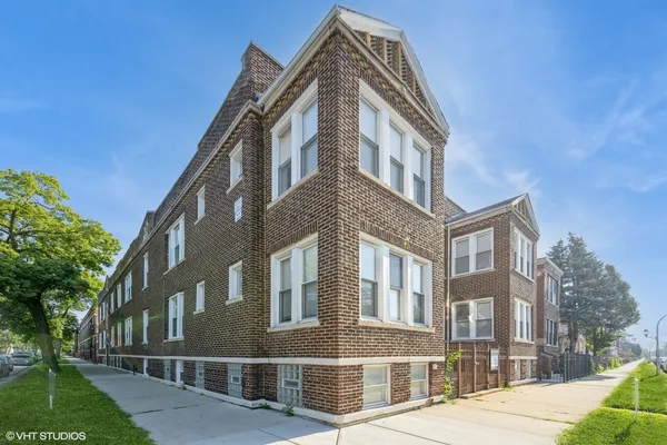 a view of a building with a yard