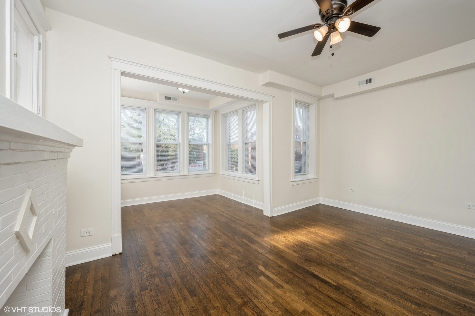 4954 West Augusta Boulevard, Unit 2 Chicago, IL 60651 - Photo 14 of 15 a view of an empty room with wooden floor and a window