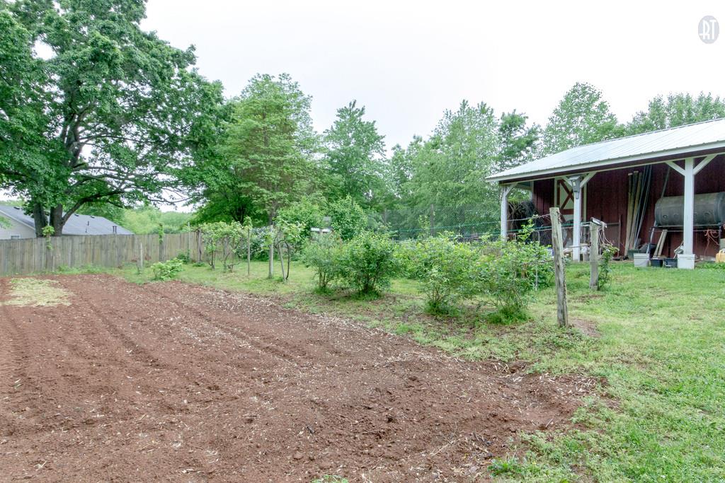 471 Calista Road White House, TN 37188 - Photo 25 of 25 Planting area #2 with storage building in view