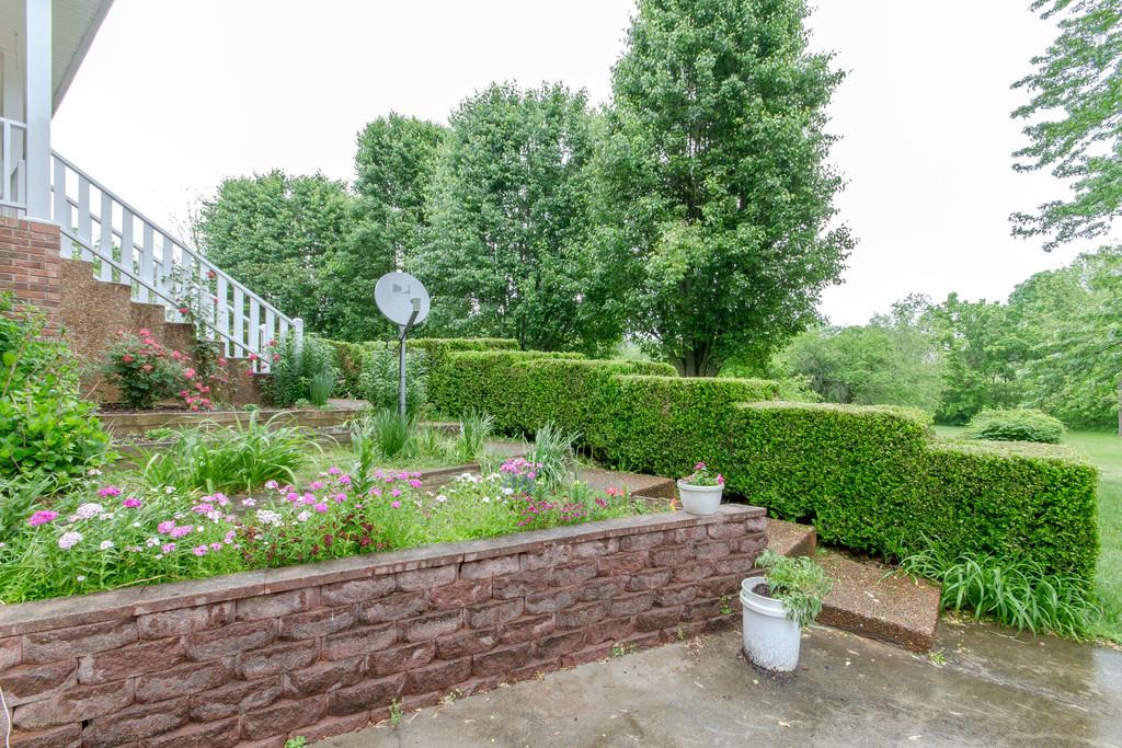 471 Calista Road White House, TN 37188 - Photo 6 of 25 Flowers/landscaping at front of the home