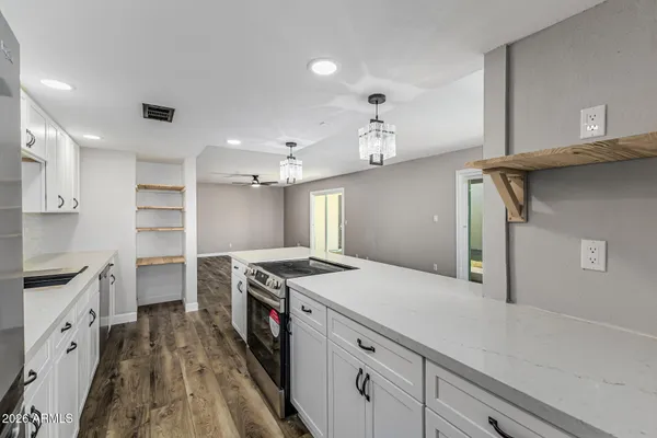 a kitchen with a stove and a sink