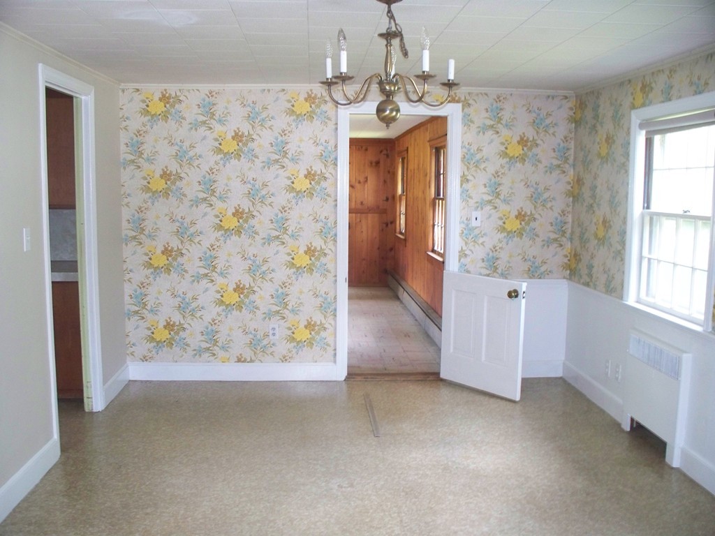 23 Summer Road Boxborough, MA 01719 - Photo 9 of 14 wooden floor in an empty room with a window