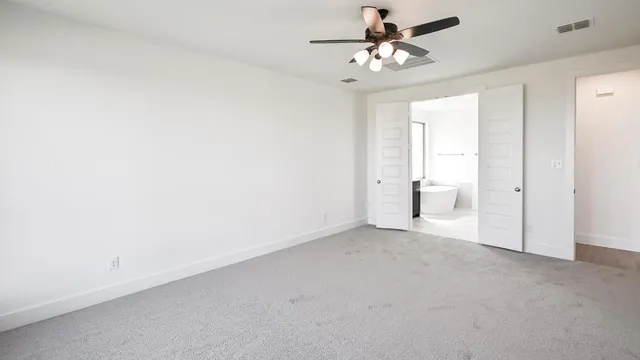 an empty room with a bathroom