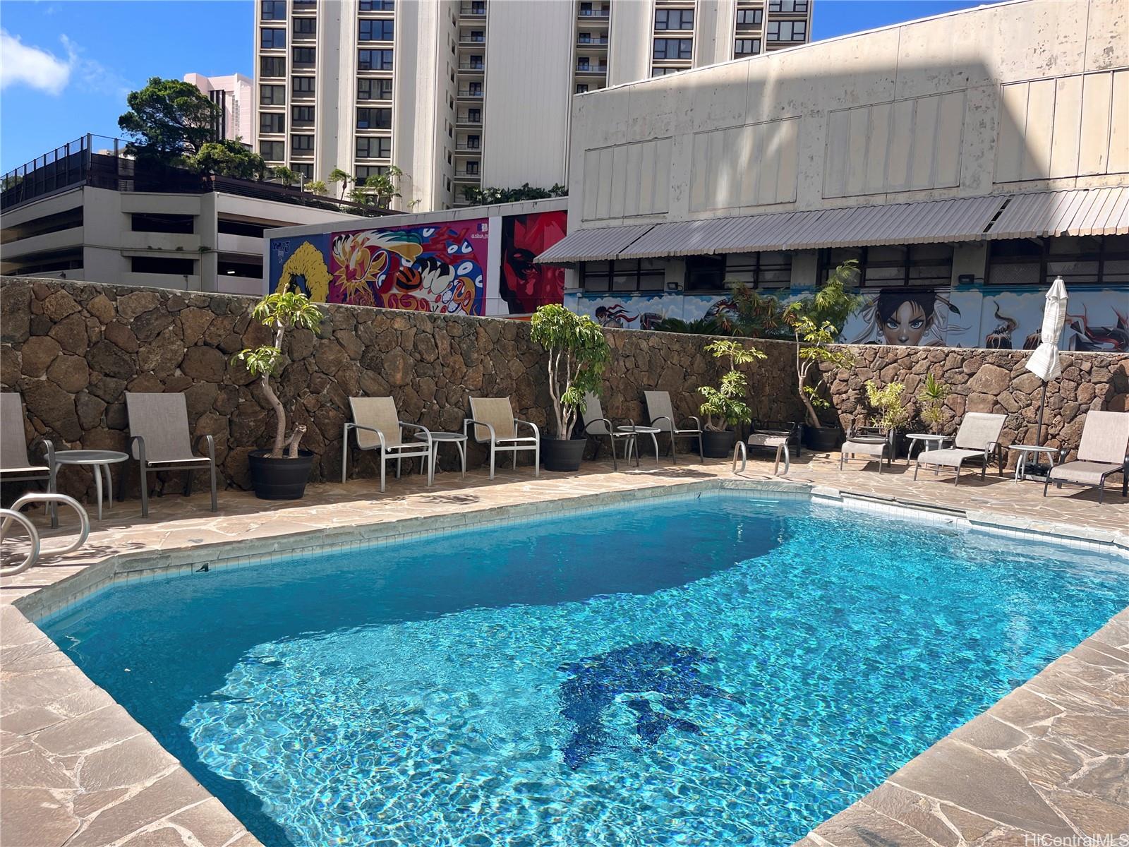 419 Atkinson Drive, Unit 1205 Honolulu, HI 96814 - Photo 12 of 15 a view of swimming pool with outdoor seating