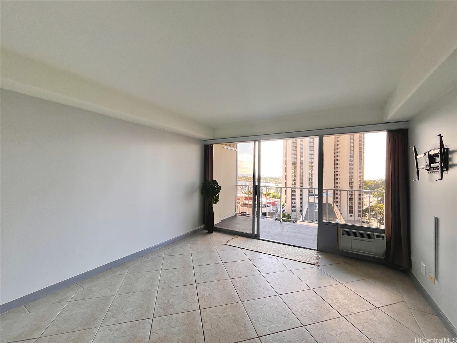 419 Atkinson Drive, Unit 1205 Honolulu, HI 96814 - Photo 3 of 15 a view of an empty room with a window
