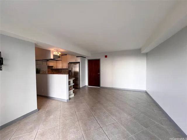 a view of a kitchen with a sink and a refrigerator