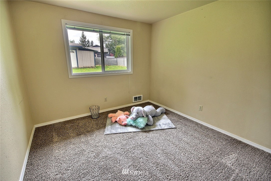7308 Vandermark Road East Bonney Lake, WA 98391 - Photo 12 of 30 a room with toys and wooden floor