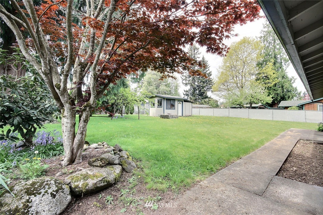 7308 Vandermark Road East Bonney Lake, WA 98391 - Photo 15 of 30 a view of a garden with a tree