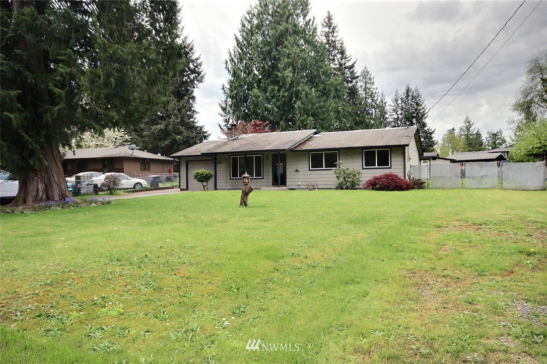 7308 Vandermark Road East Bonney Lake, WA 98391 - Photo 18 of 30 a view of a house with a yard and sitting area