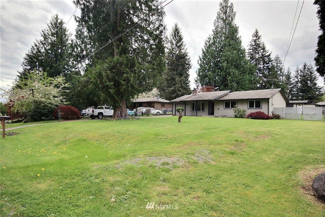 7308 Vandermark Road East Bonney Lake, WA 98391 - Photo 19 of 30 a front view of house with yard and green space