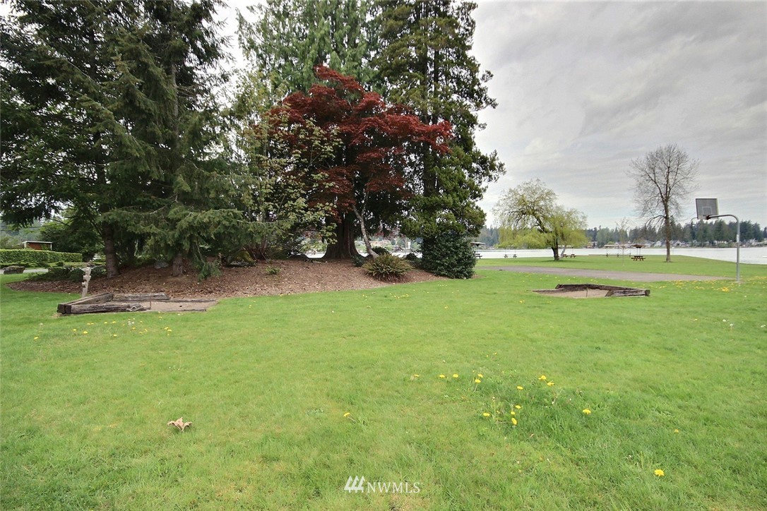 7308 Vandermark Road East Bonney Lake, WA 98391 - Photo 25 of 30 a view of green field with trees around