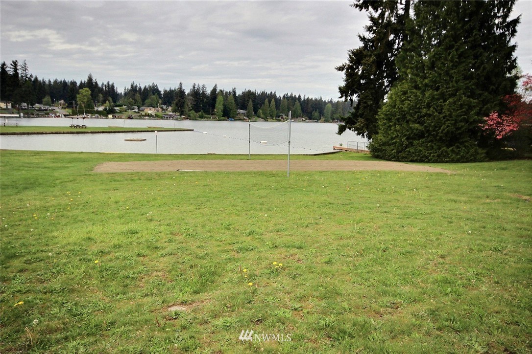 7308 Vandermark Road East Bonney Lake, WA 98391 - Photo 27 of 30 a view of a green field with trees