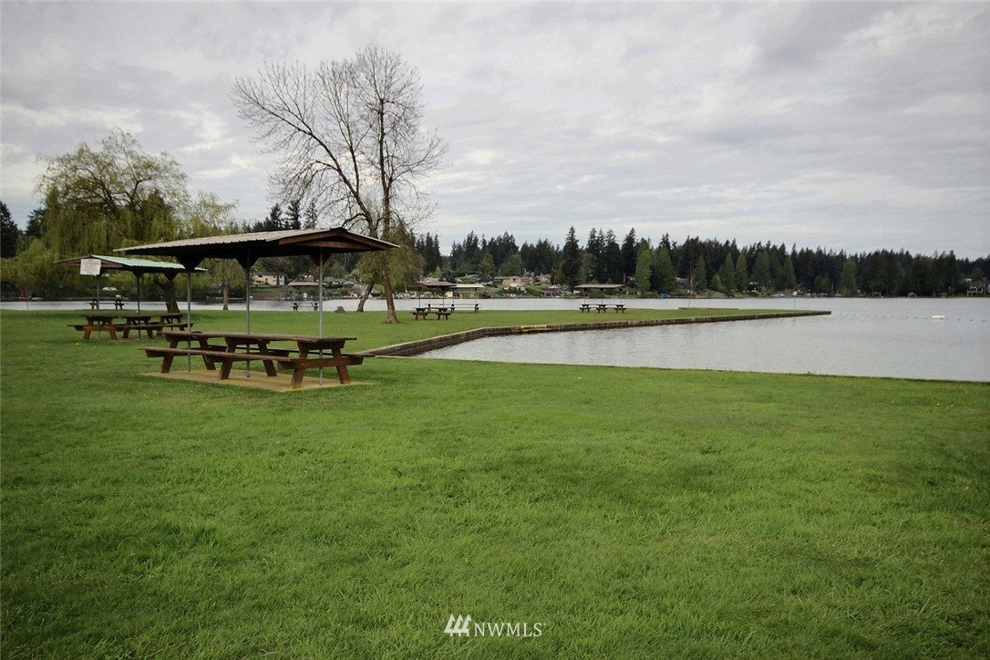 7308 Vandermark Road East Bonney Lake, WA 98391 - Photo 28 of 30 a view of a lake with houses in the back