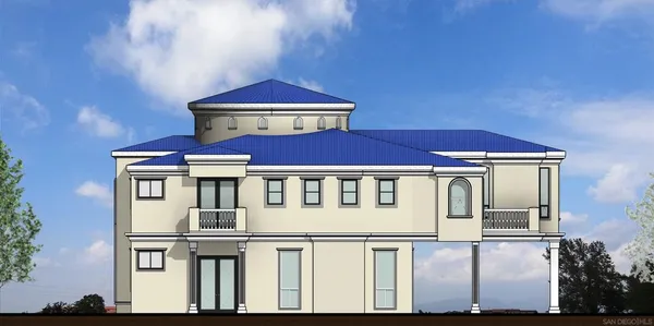 a view of a white house with large windows